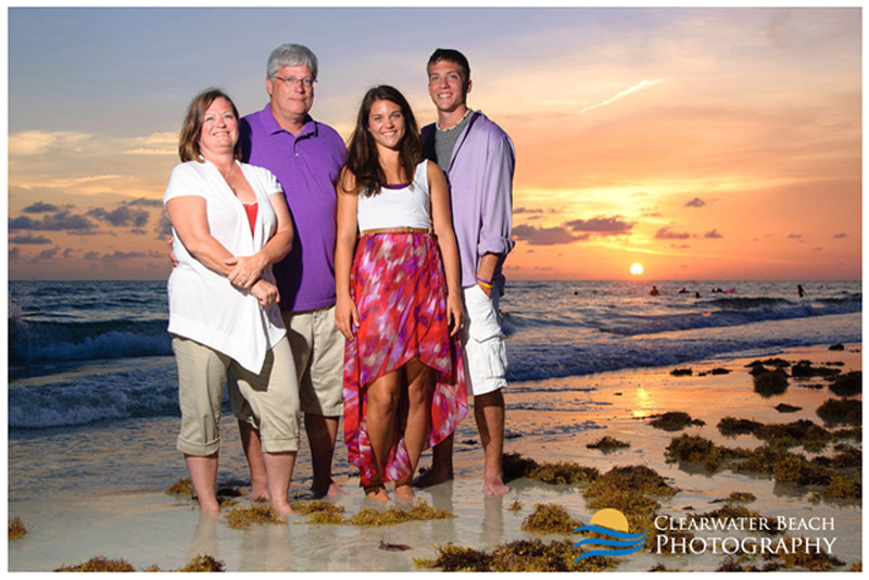 Family in front of Clearwater Beach setting sun